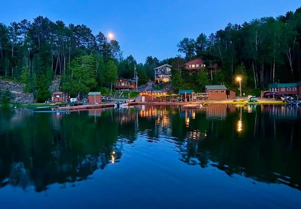 Muskie Bay Resort docks and cabins on Crow Lake at dusk