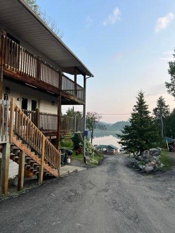 Two-story cabin at dusk on Crow Lake