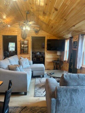 Cabin living room with vaulted wood ceiling